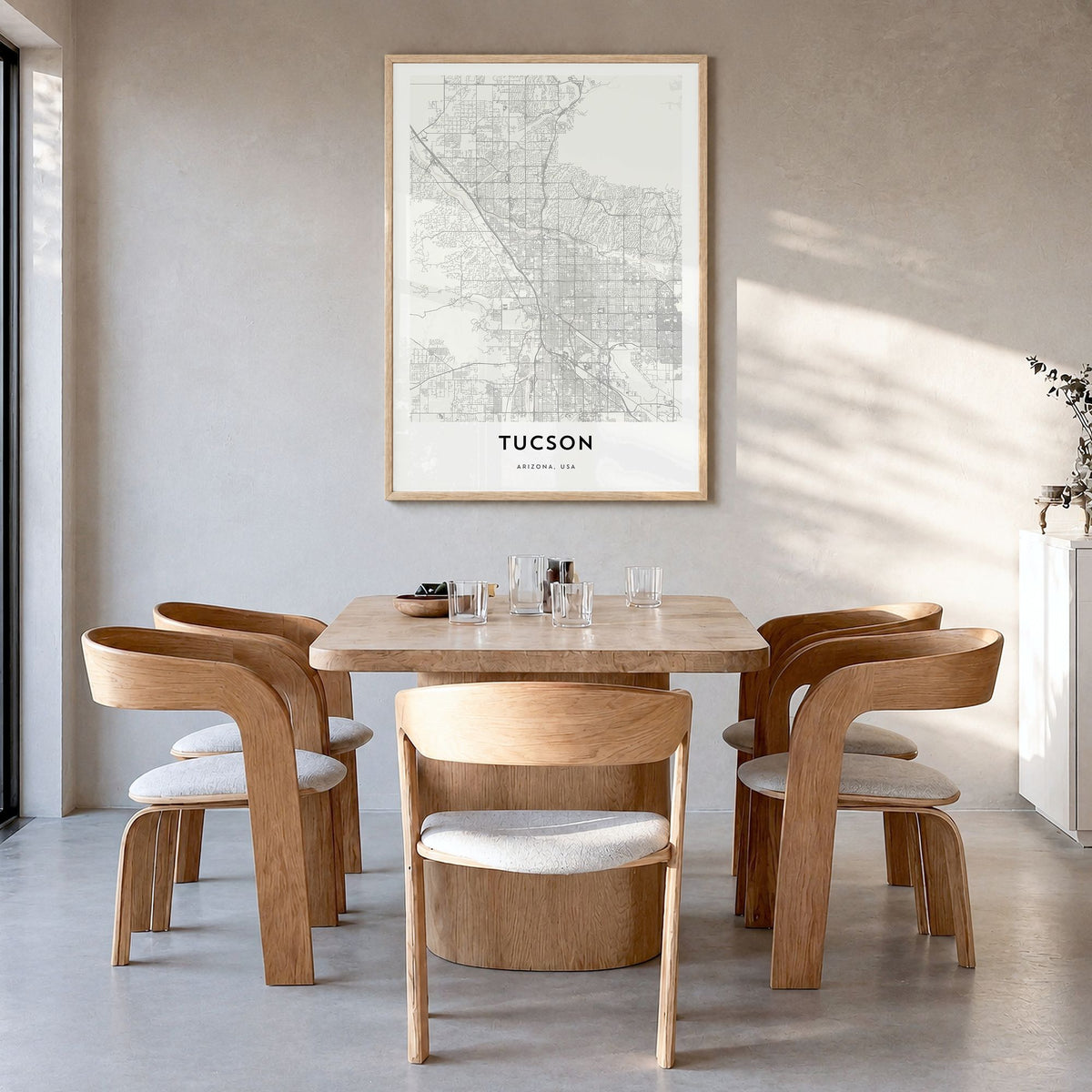 Tucson Map Poster in a natural wood frame, hanging in a dining room