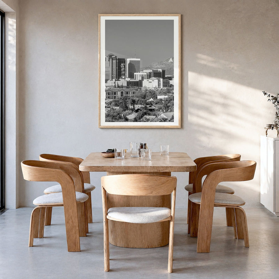 Tucson Photo Poster in a natural wood frame, hanging in a dining room, white border