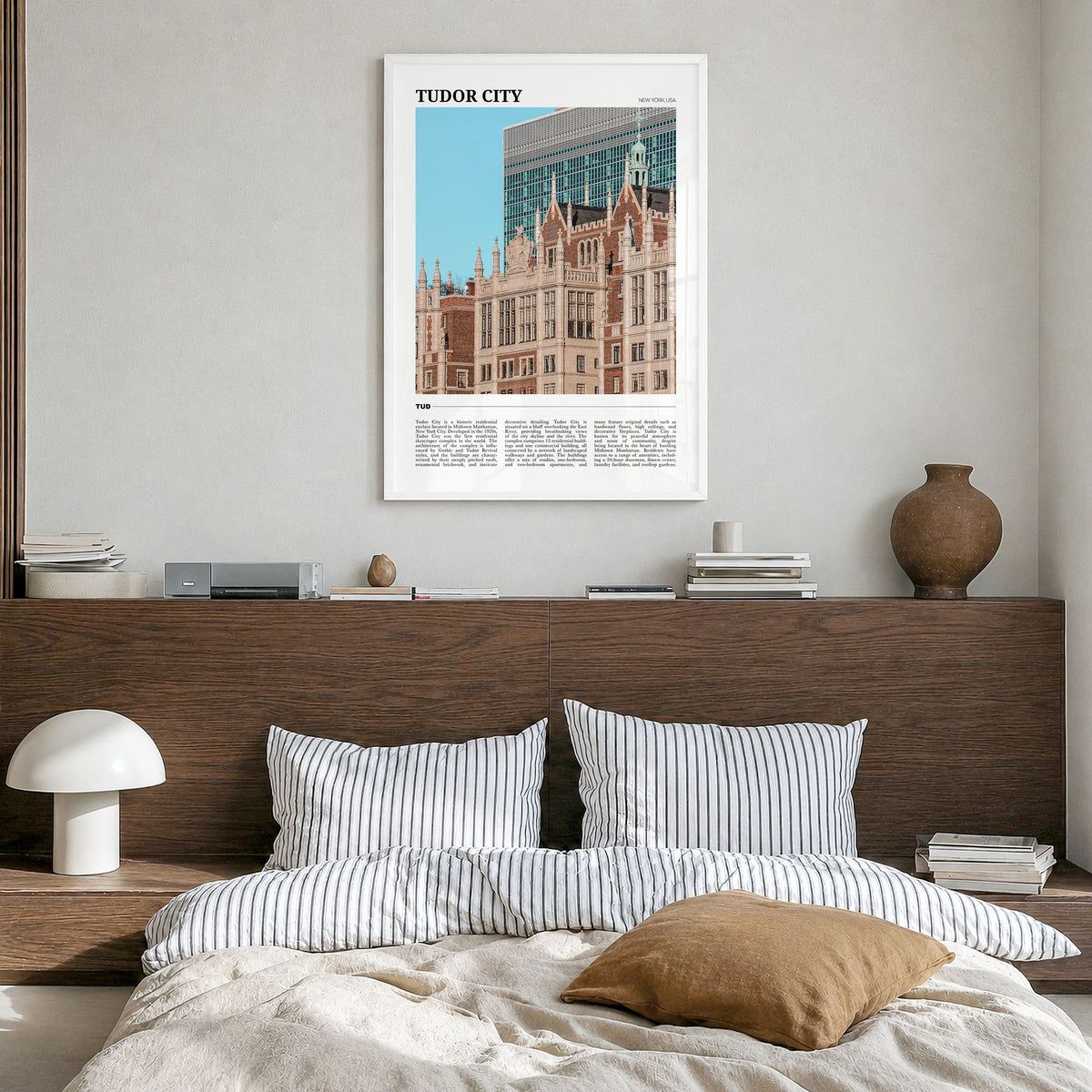 Tudor City Travel Poster in a white wood frame, hanging in a bedroom