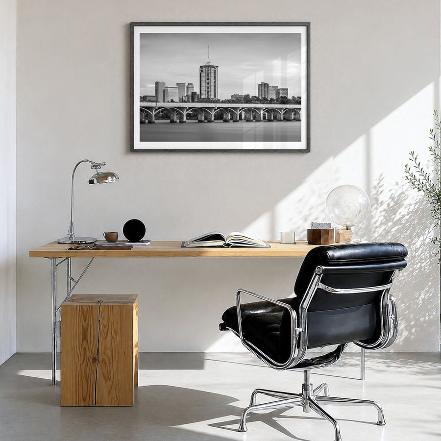 Tulsa Photo Poster in a black wood frame, hanging in a bright home office, white border