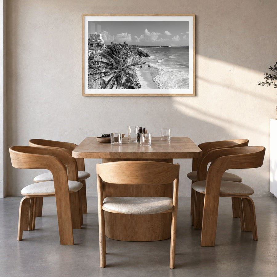 Tulum Photo Poster in a natural wood frame, hanging in a dining room, white border