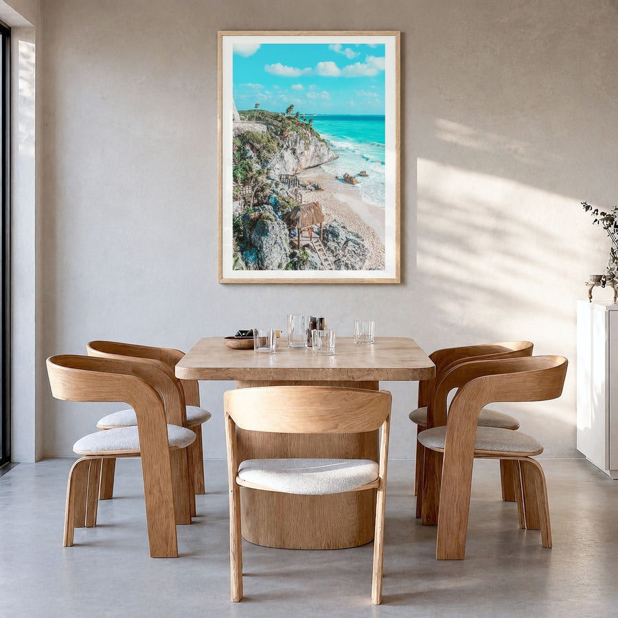 Tulum Photo No 1 Poster in a natural wood frame, hanging in a dining room, white border
