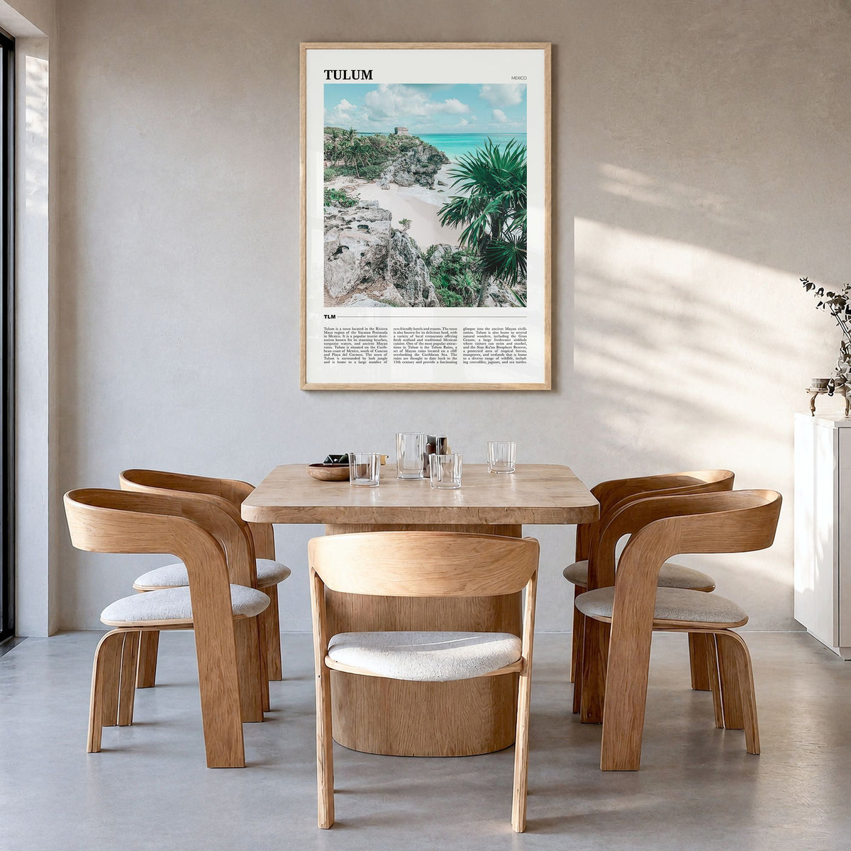 Tulum Travel Poster in a natural wood frame, hanging in a dining room