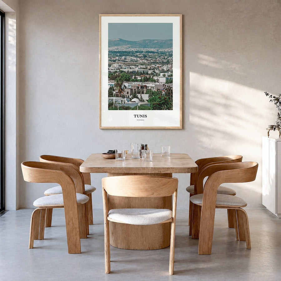 Tunis Classic Poster in a natural wood frame, hanging in a dining room