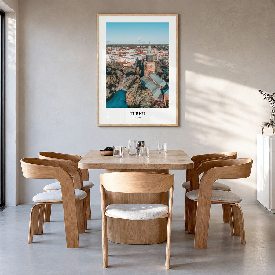 Turku Classic Poster in a natural wood frame, hanging in a dining room