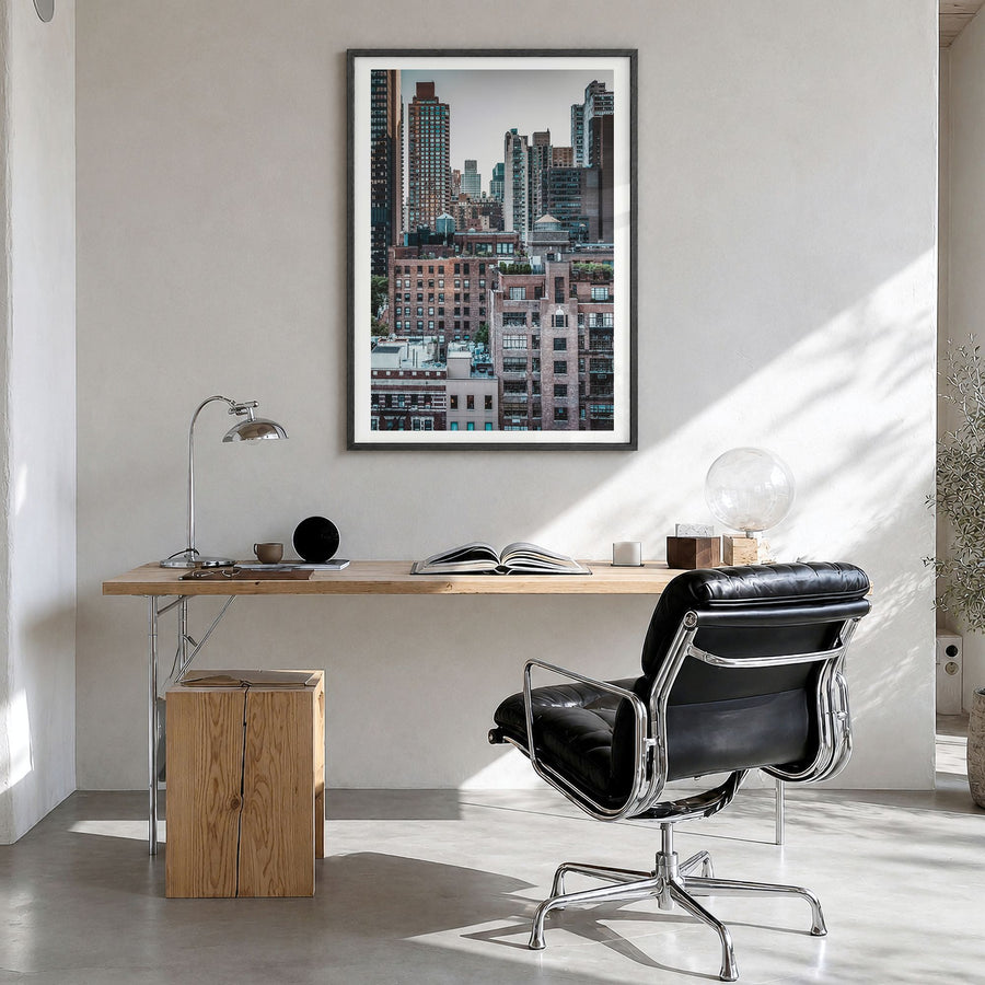 Turtle Bay Photo Poster in a black wood frame, hanging in a bright home office, white border