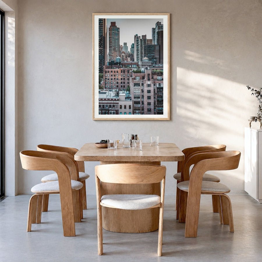 Turtle Bay Photo Poster in a natural wood frame, hanging in a dining room, white border