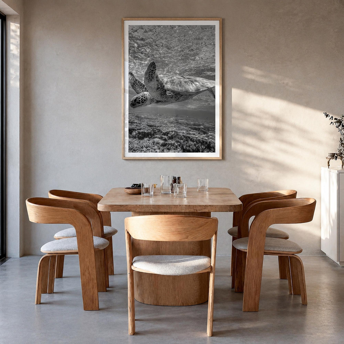Turtle black & white photo poster – vertical wall art in natural wood frame with white border, hanging on wall