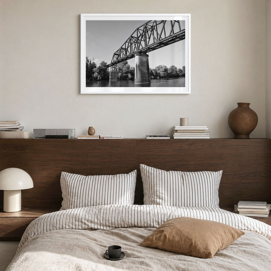 Tuscaloosa Photo Poster in a white wood frame, hanging in a bedroom, white border