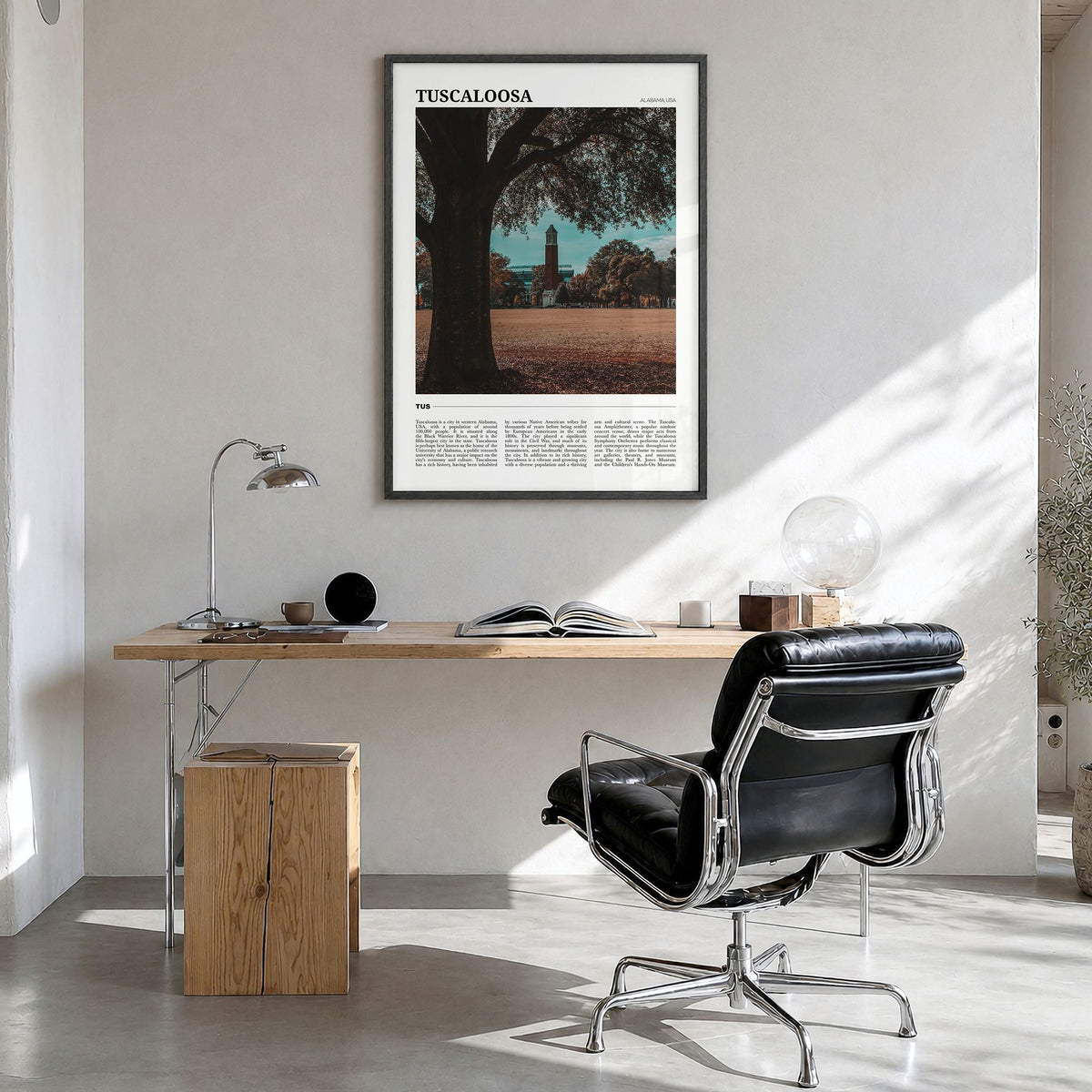 Tuscaloosa Travel Poster in a black wood frame, hanging in a bright home office