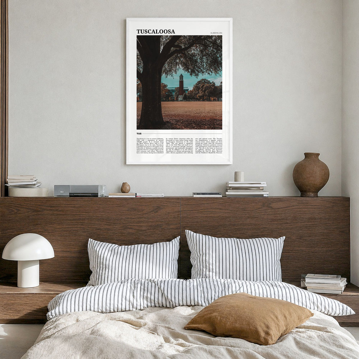 Tuscaloosa Travel Poster in a white wood frame, hanging in a bedroom