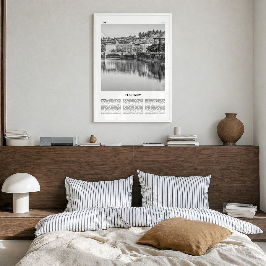 Tuscany Newspaper Poster in a white wood frame, hanging in a bedroom