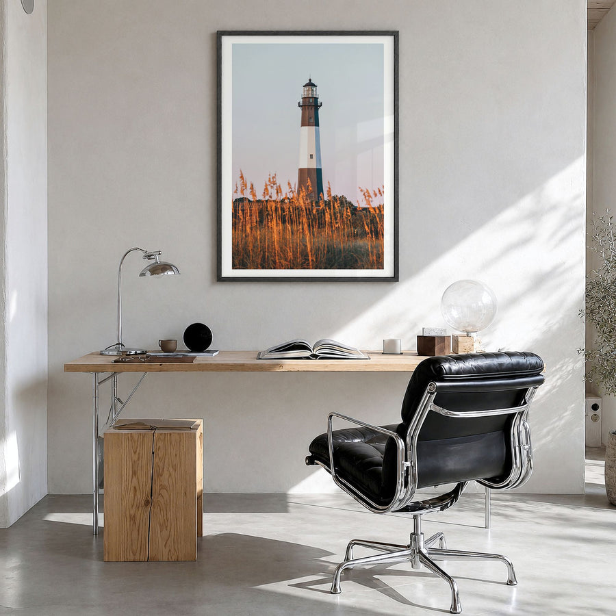 Tybee Island Photo Poster in a black wood frame, hanging in a bright home office, white border