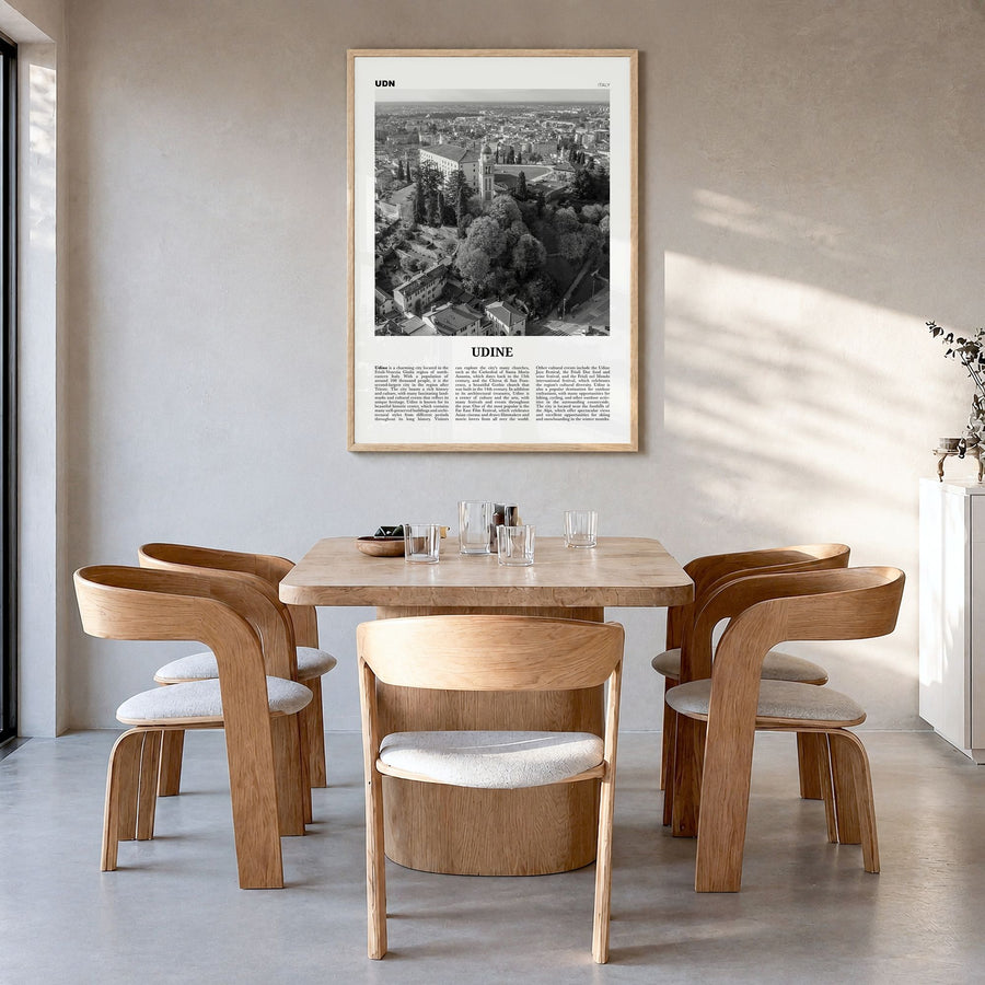 Udine Newspaper Poster in a natural wood frame, hanging in a dining room