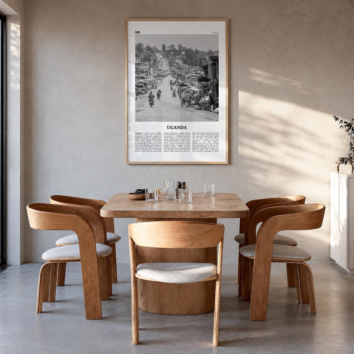 Uganda black & white newspaper poster of Africa – vertical wall art in natural wood frame, hanging on wall