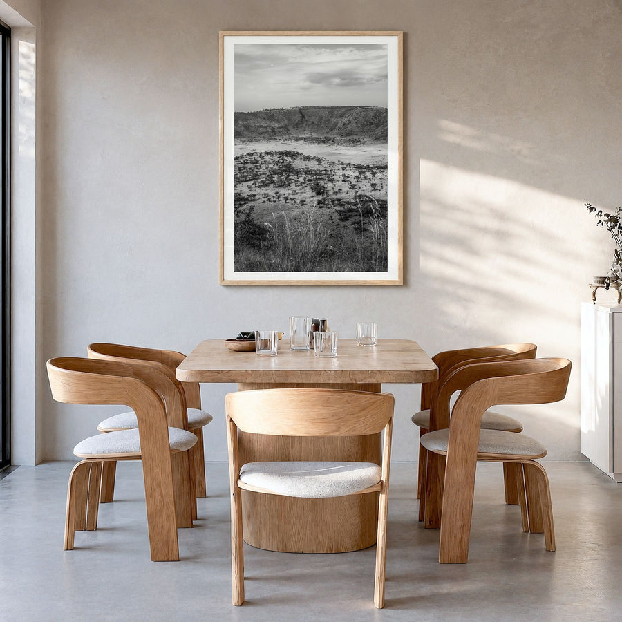 Uganda Photo Poster in a natural wood frame, hanging in a dining room, white border