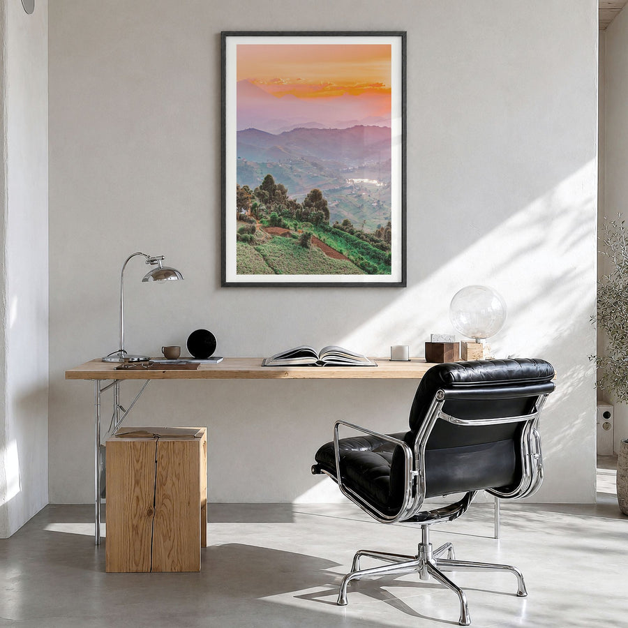 Uganda Photo Poster in a black wood frame, hanging in a bright home office, white border