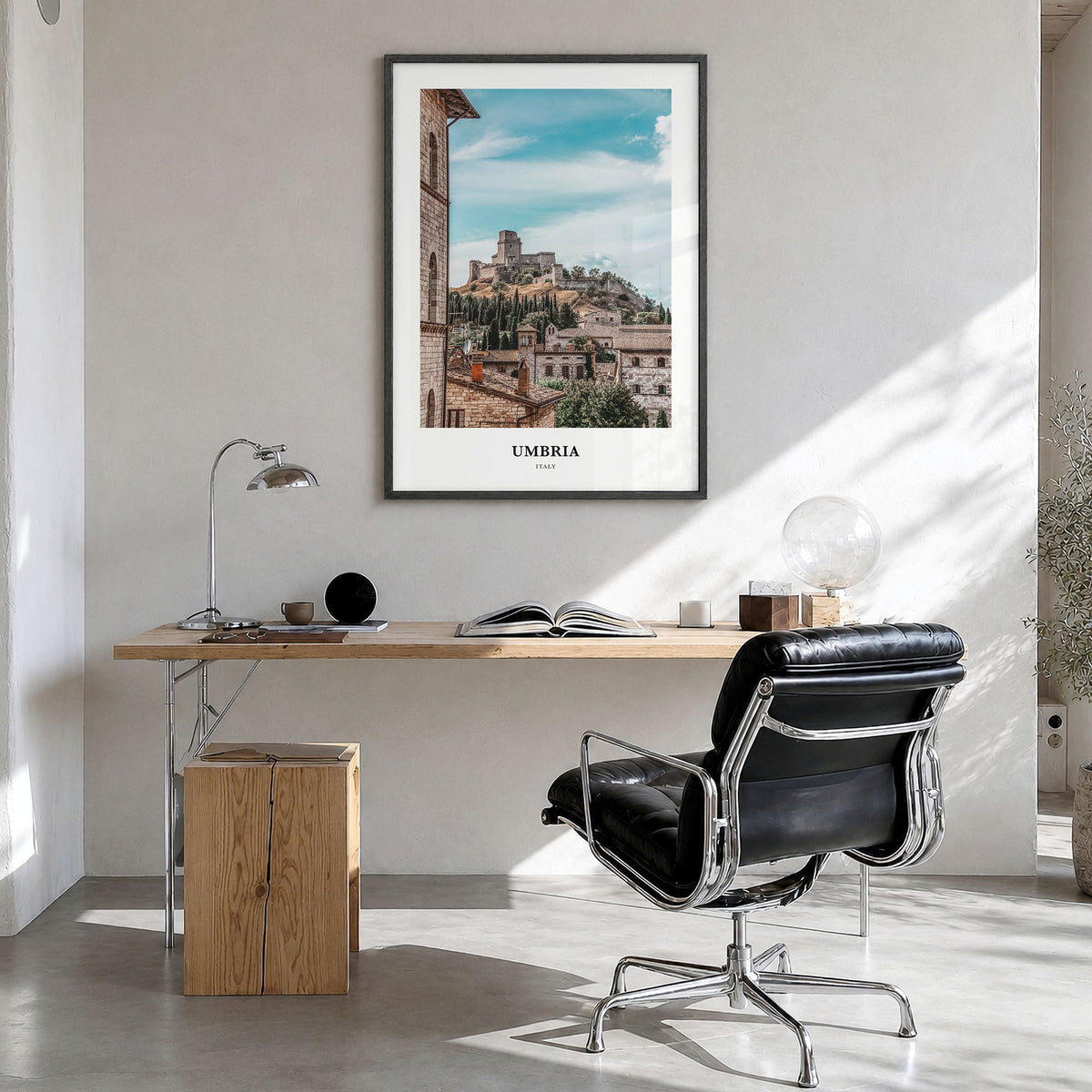 Umbria Classic Poster in a black wood frame, hanging in a bright home office