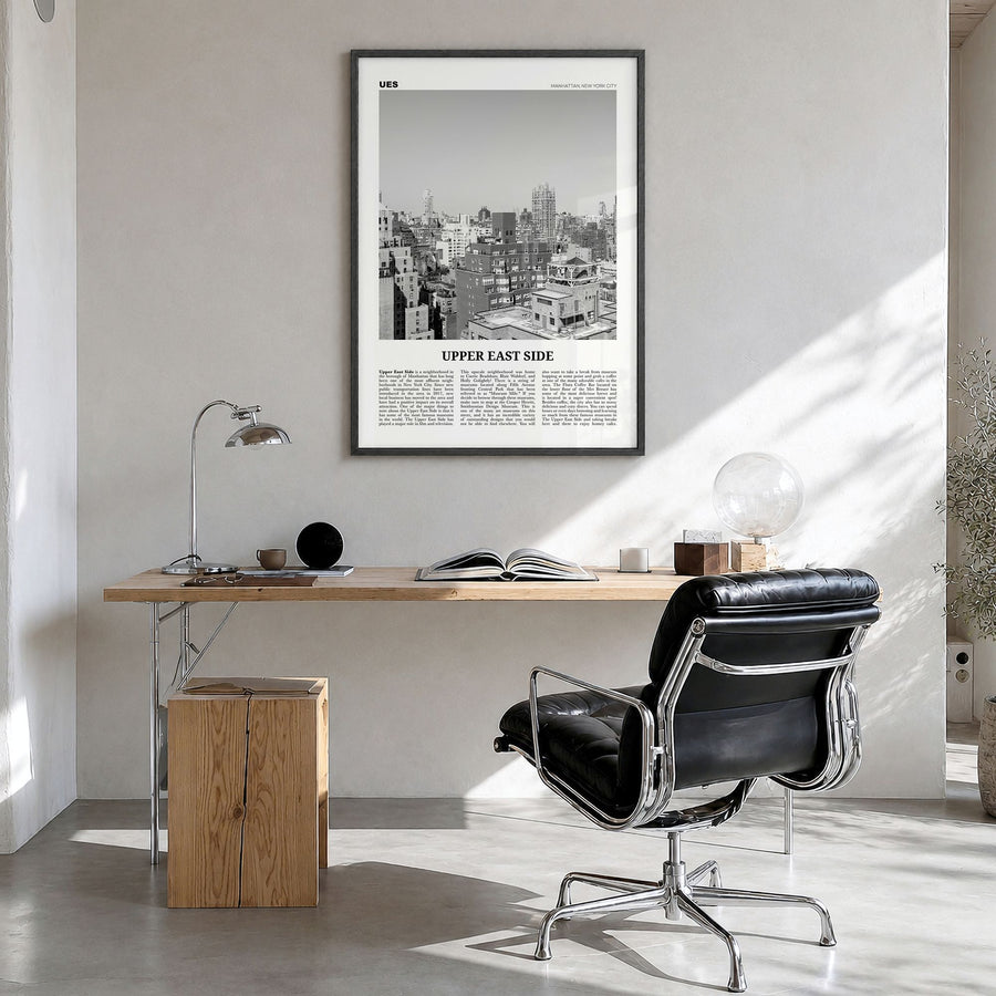 Upper East Side Newspaper Poster in a black wood frame, hanging in a bright home office