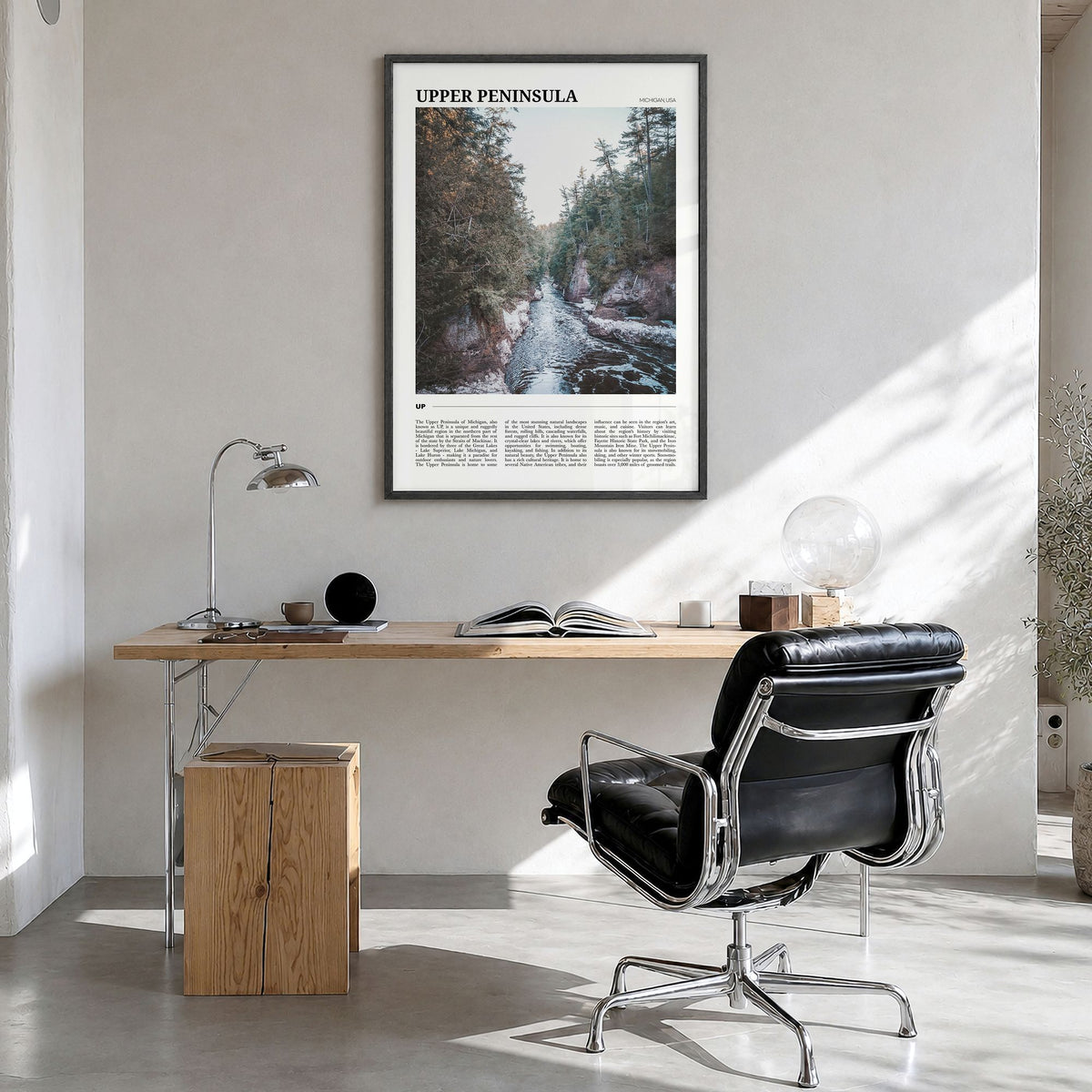 Upper Peninsula Travel Poster in a black wood frame, hanging in a bright home office