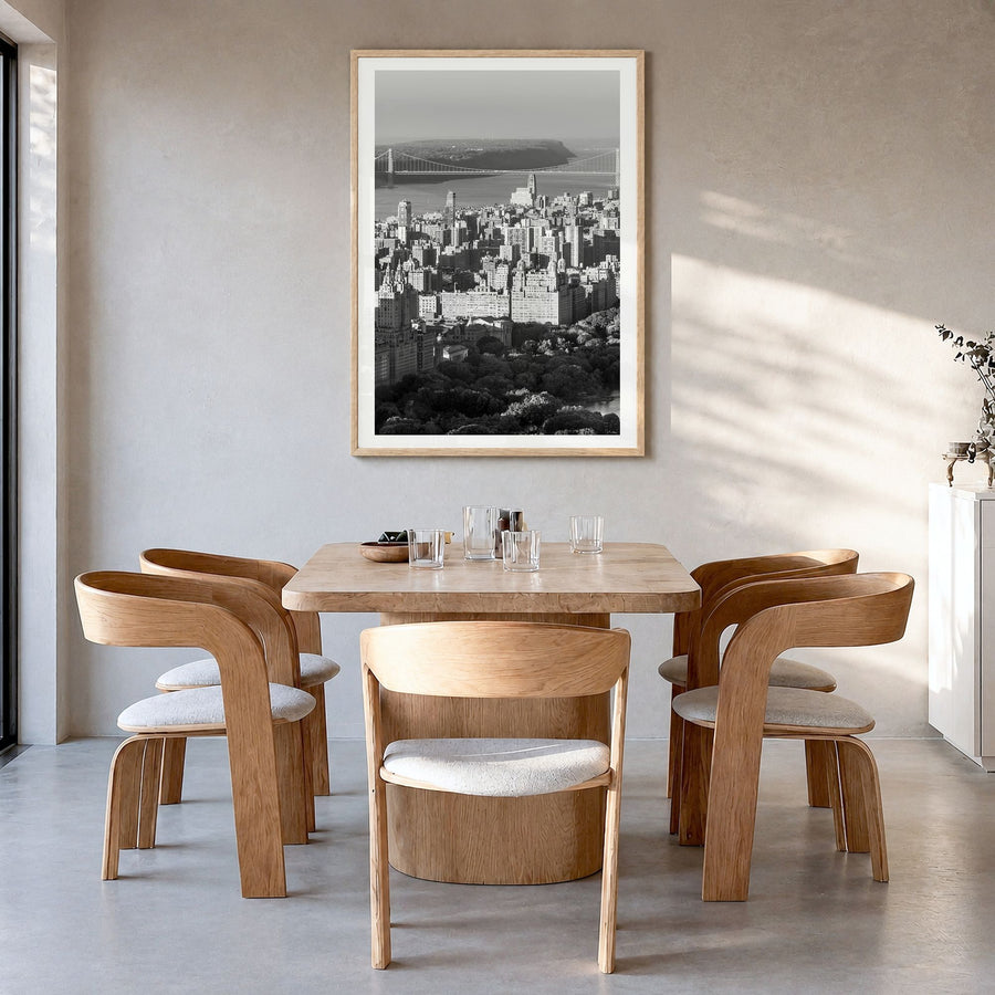 Upper West Side Photo No 1 Poster in a natural wood frame, hanging in a dining room, white border