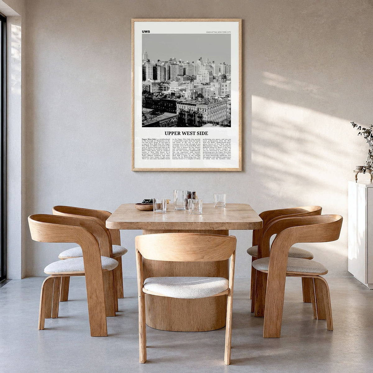 Upper West Side Newspaper Poster in a natural wood frame, hanging in a dining room