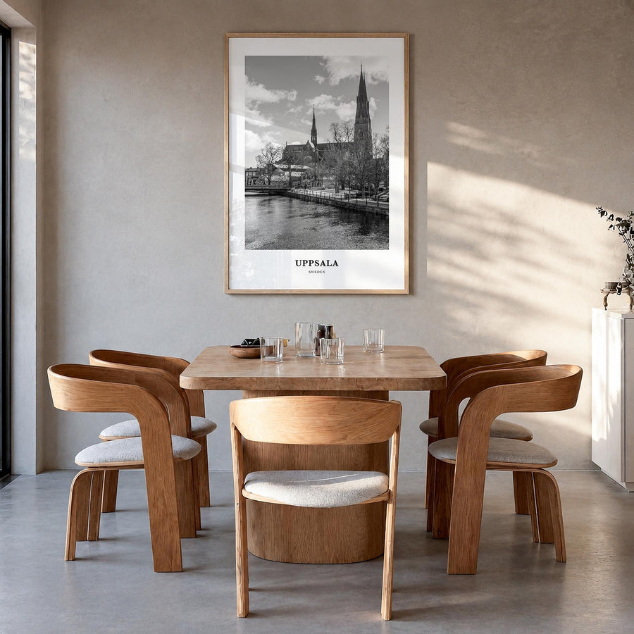 Uppsala black & white classic poster of Sweden – vertical wall art in natural wood frame, hanging on wall