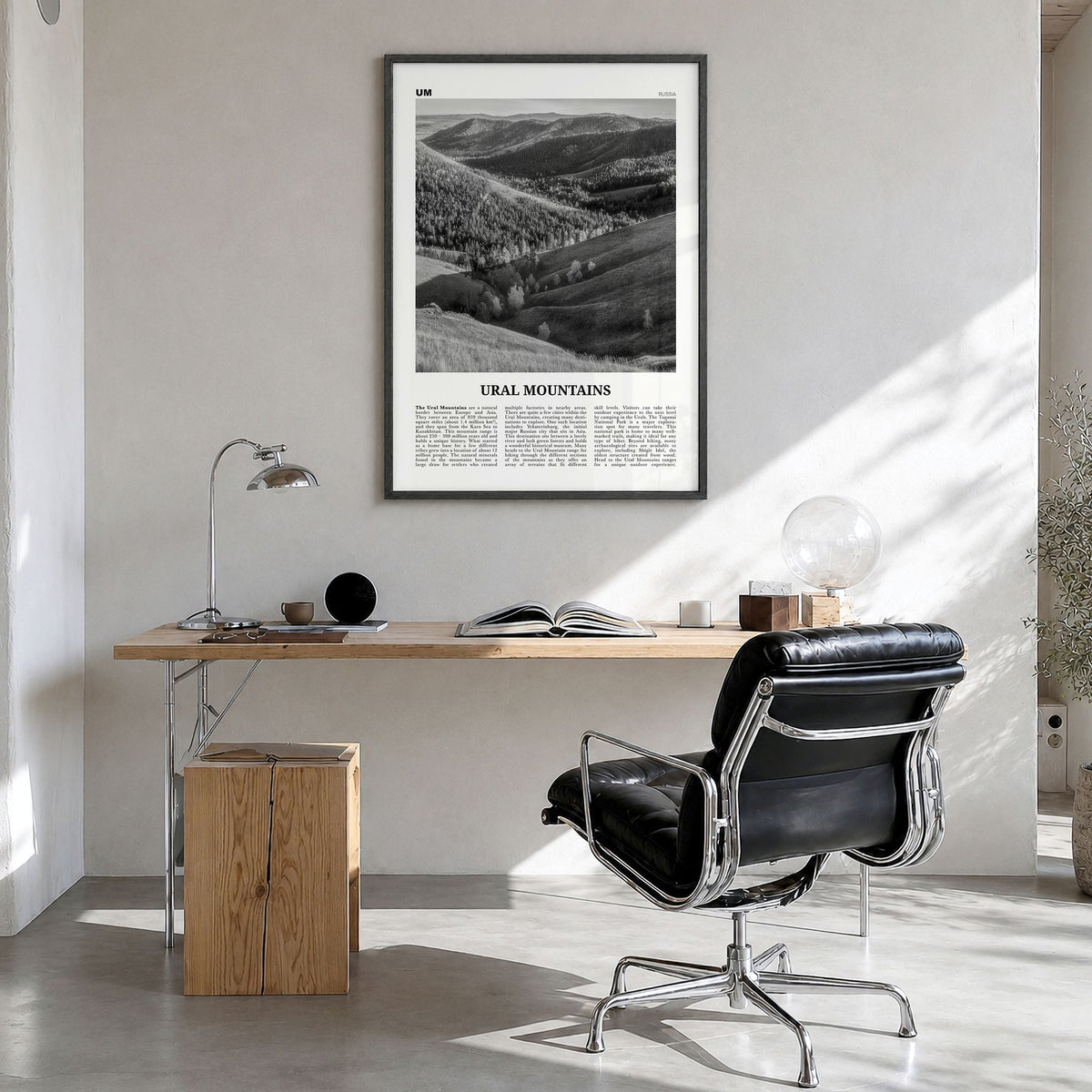 Ural Mountains Newspaper Poster in a black wood frame, hanging in a bright home office