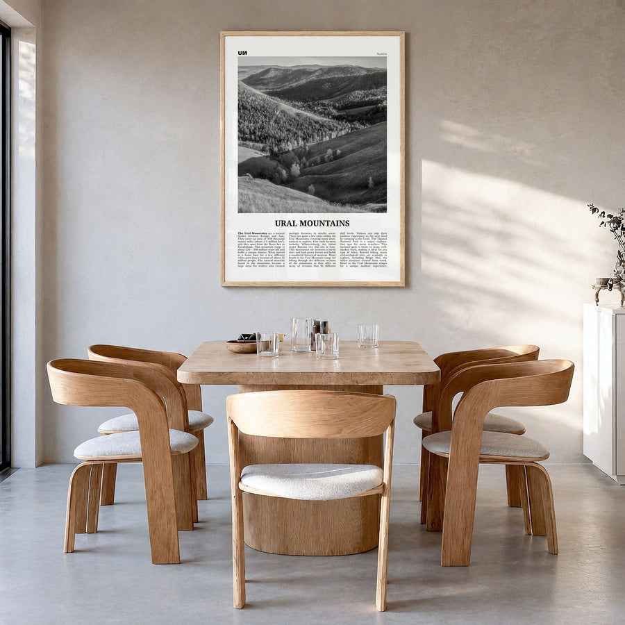 Ural Mountains Newspaper Poster in a natural wood frame, hanging in a dining room