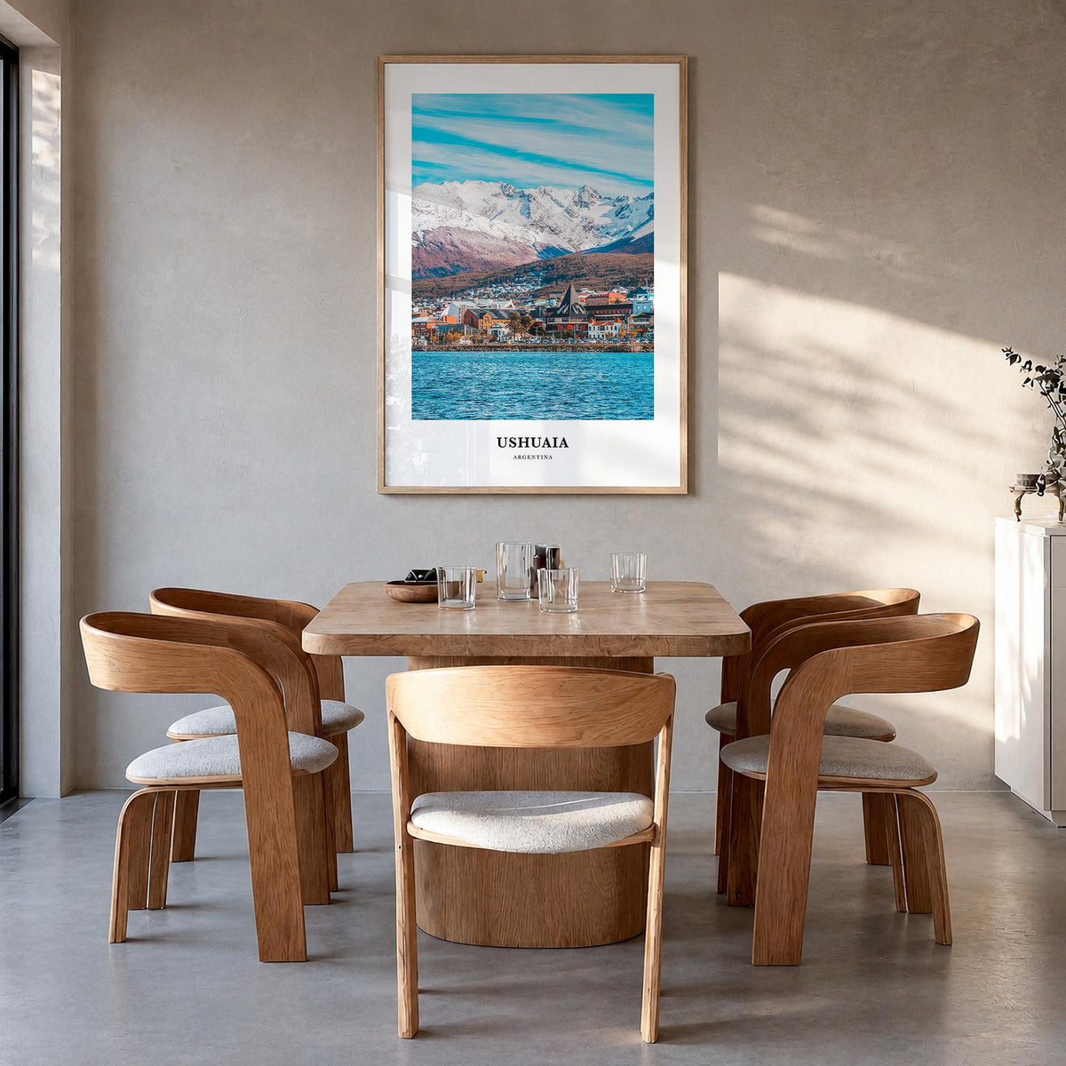 Ushuaia colorful classic poster of Argentina – vertical wall art in natural wood frame, hanging on wall