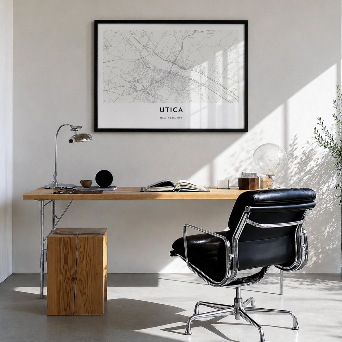 Utica black & white map poster of New York, USA – horizontal wall art in black wood frame, hanging on wall