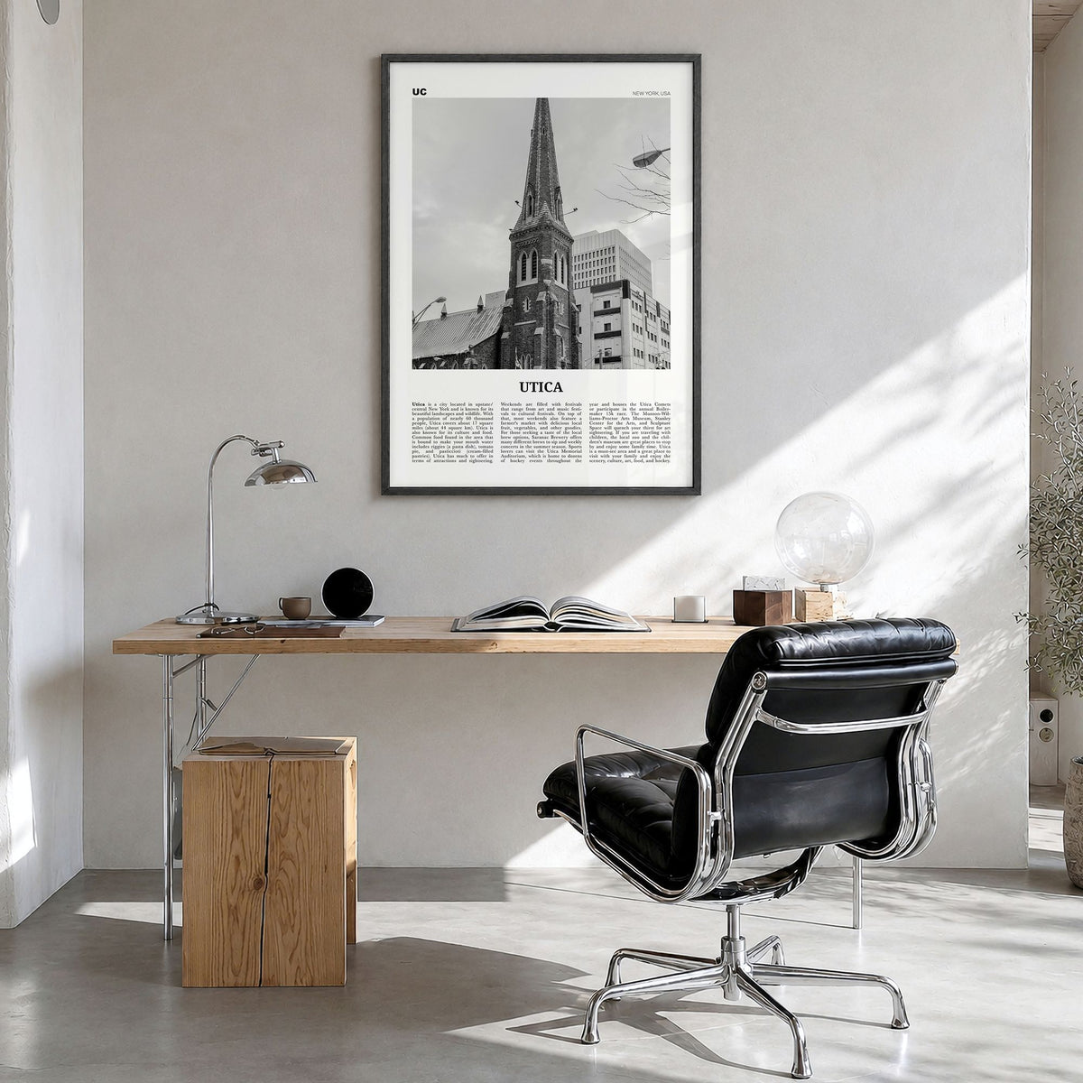 Utica Newspaper Poster in a black wood frame, hanging in a bright home office