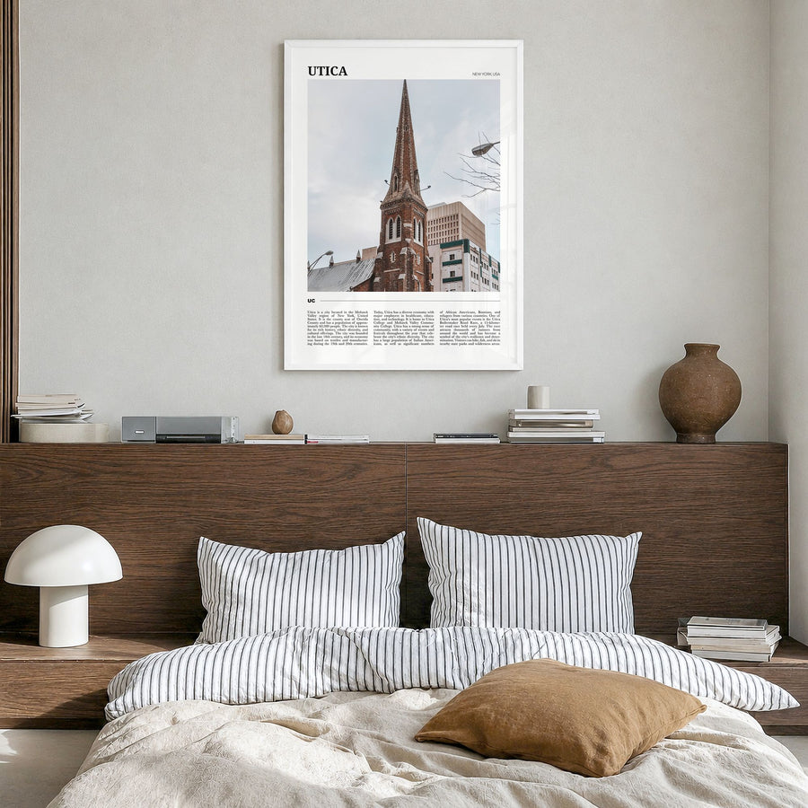 Utica Travel Poster in a white wood frame, hanging in a bedroom