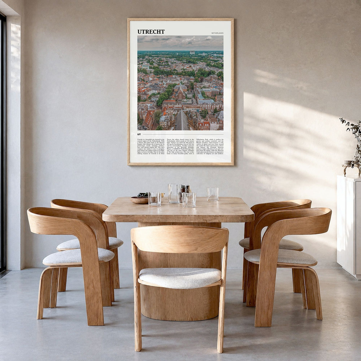 Utrecht Travel Poster in a natural wood frame, hanging in a dining room