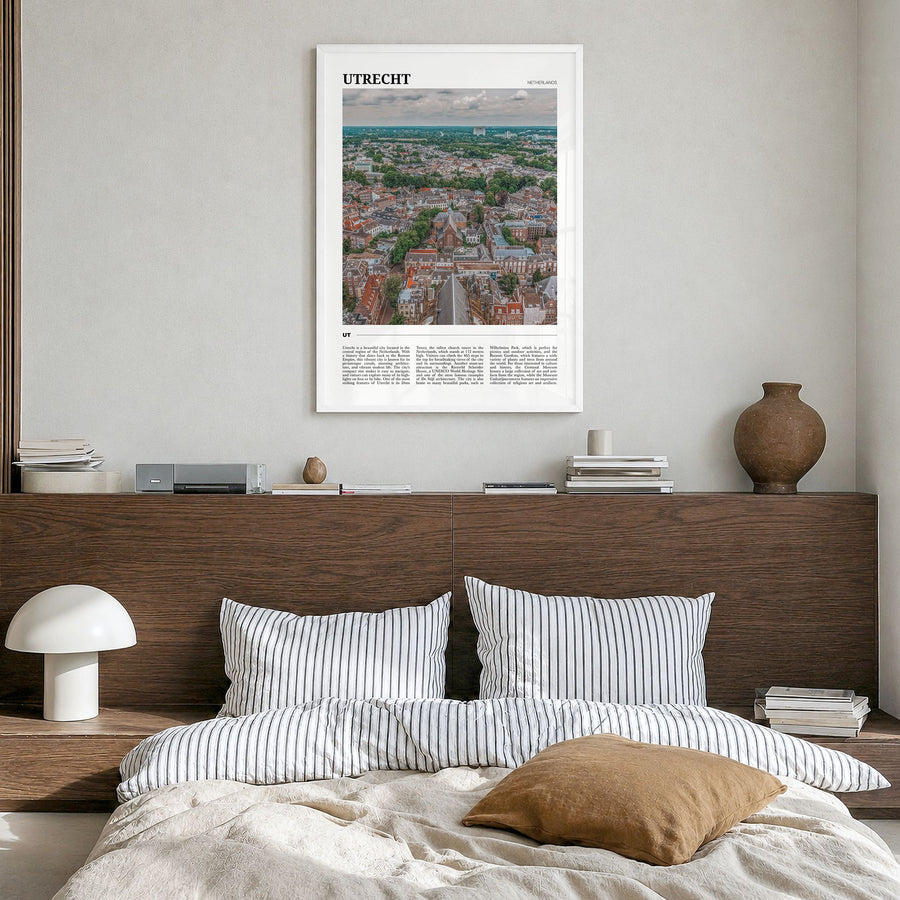Utrecht Travel Poster in a white wood frame, hanging in a bedroom