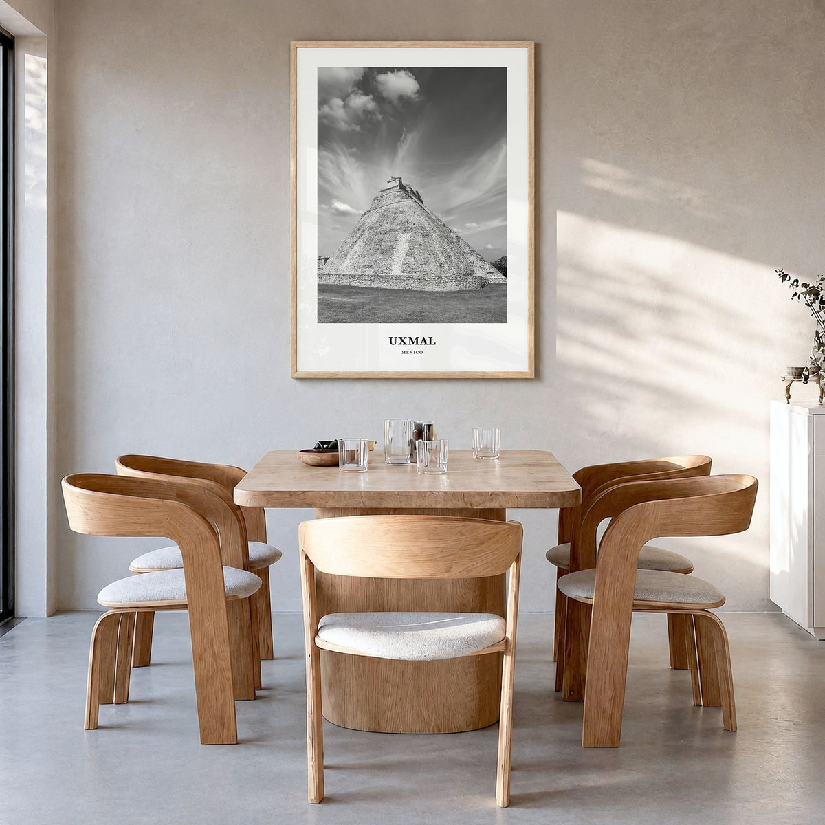 Uxmal Classic Poster in a natural wood frame, hanging in a dining room