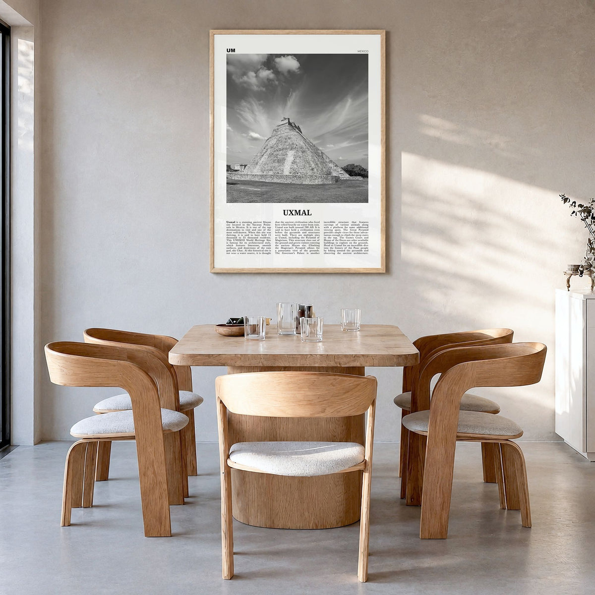 Uxmal Newspaper Poster in a natural wood frame, hanging in a dining room