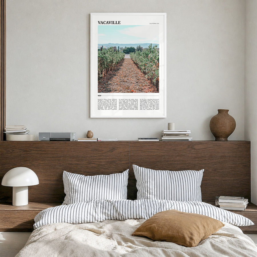 Vacaville Travel Poster in a white wood frame, hanging in a bedroom