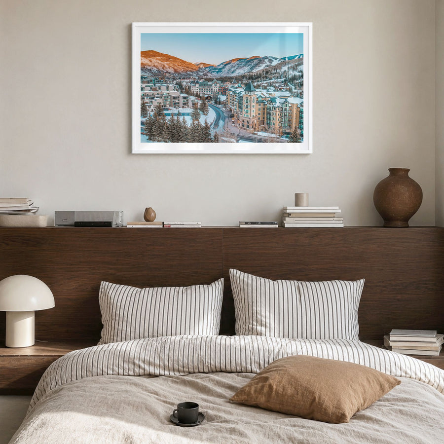 Vail Photo Poster in a white wood frame, hanging in a bedroom, white border