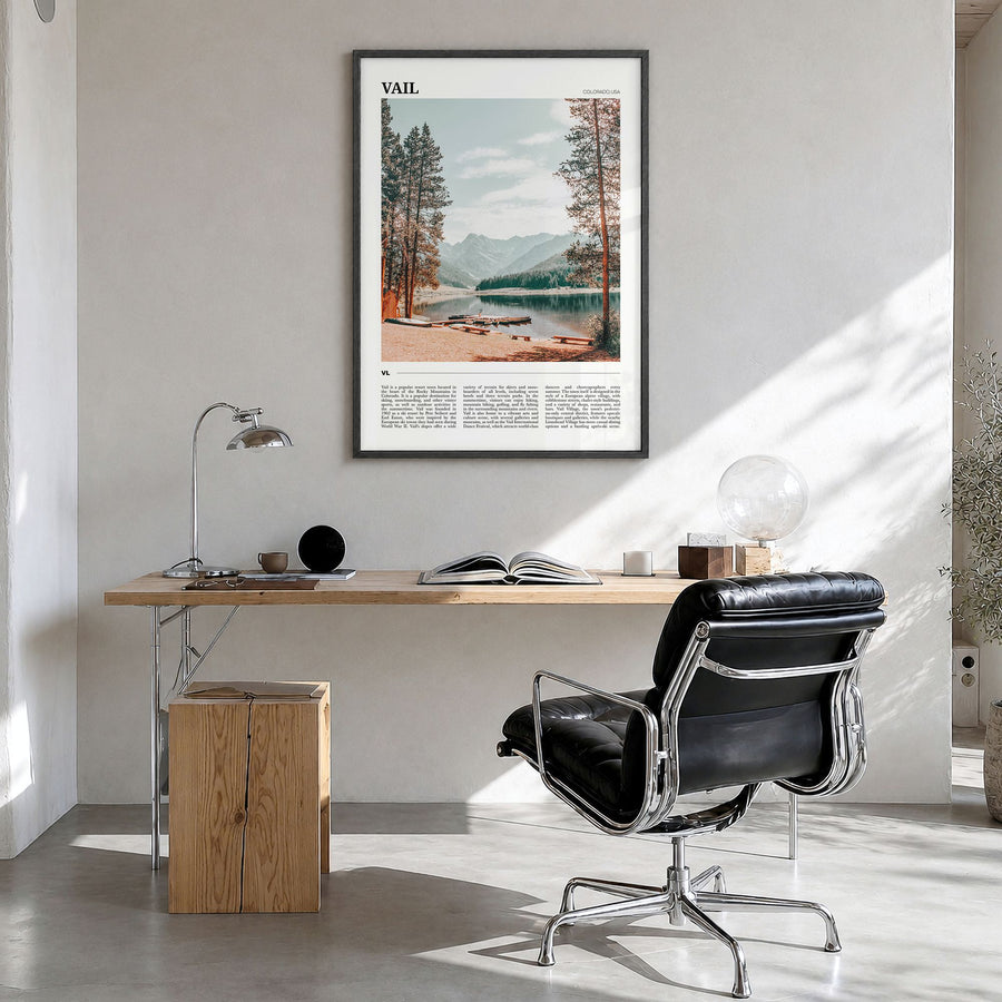 Vail Travel Poster in a black wood frame, hanging in a bright home office