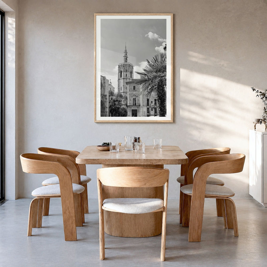 Valencia Photo Poster in a natural wood frame, hanging in a dining room, white border