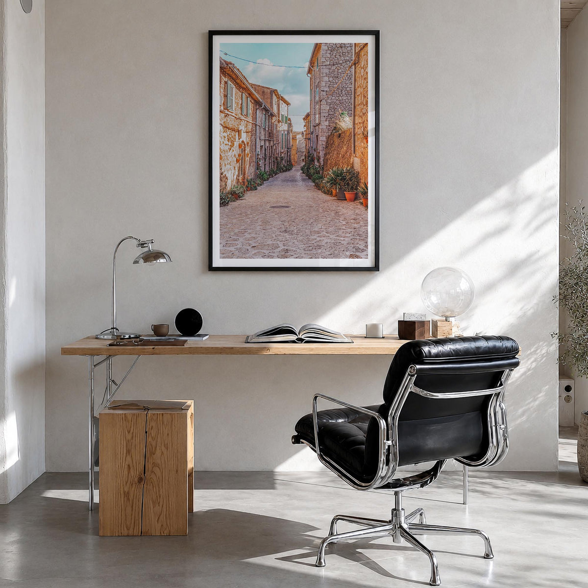 Valldemossa colorful photo poster of Spain – vertical wall art in black wood frame with white border, hanging on wall