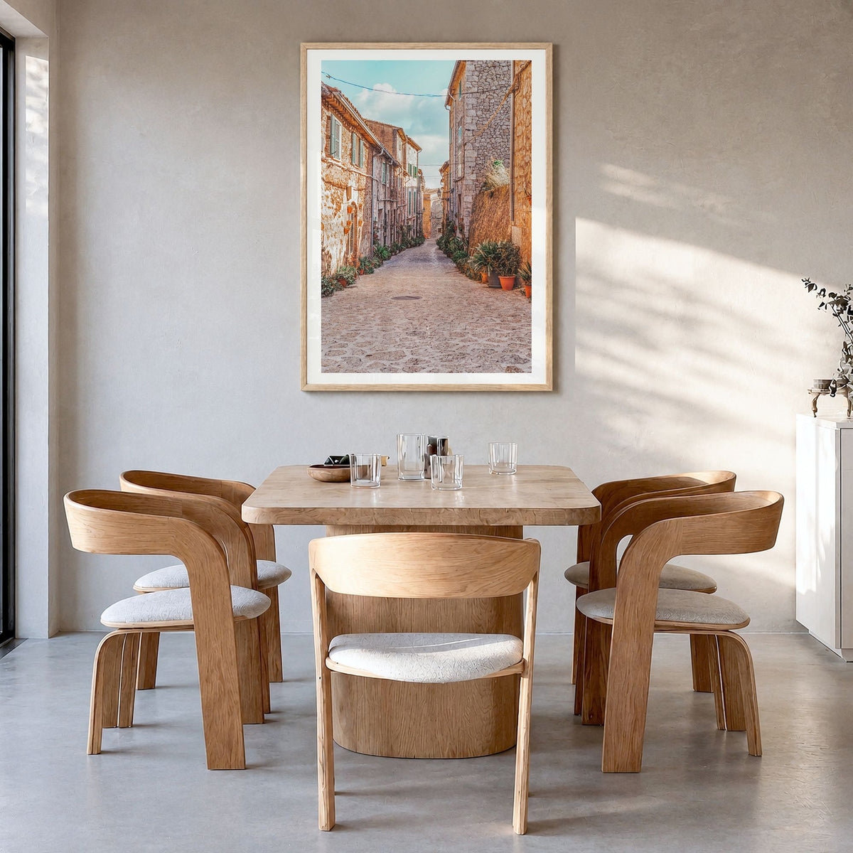 Valldemossa Photo Poster in a natural wood frame, hanging in a dining room, white border