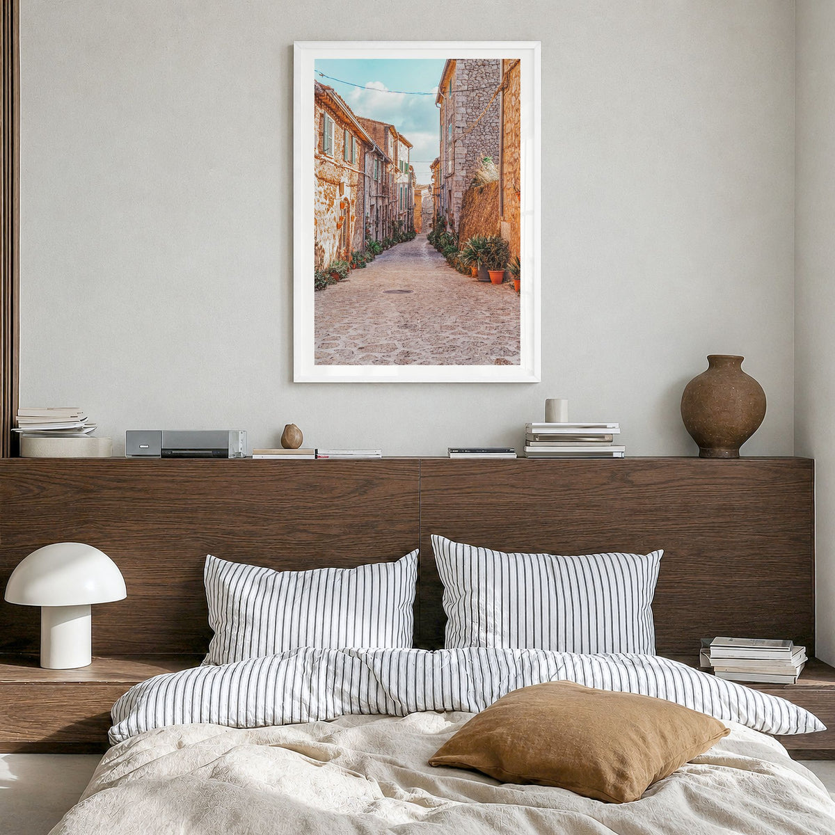 Valldemossa Photo Poster in a white wood frame, hanging in a bedroom, white border