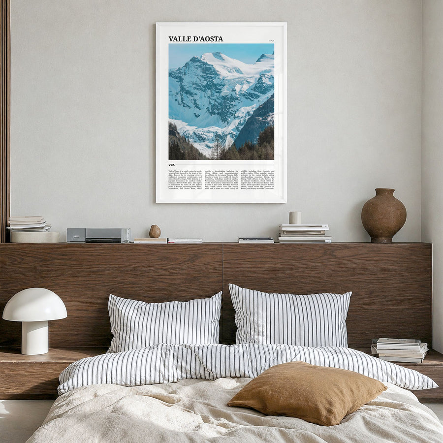 Valle d'Aosta Travel Poster in a white wood frame, hanging in a bedroom