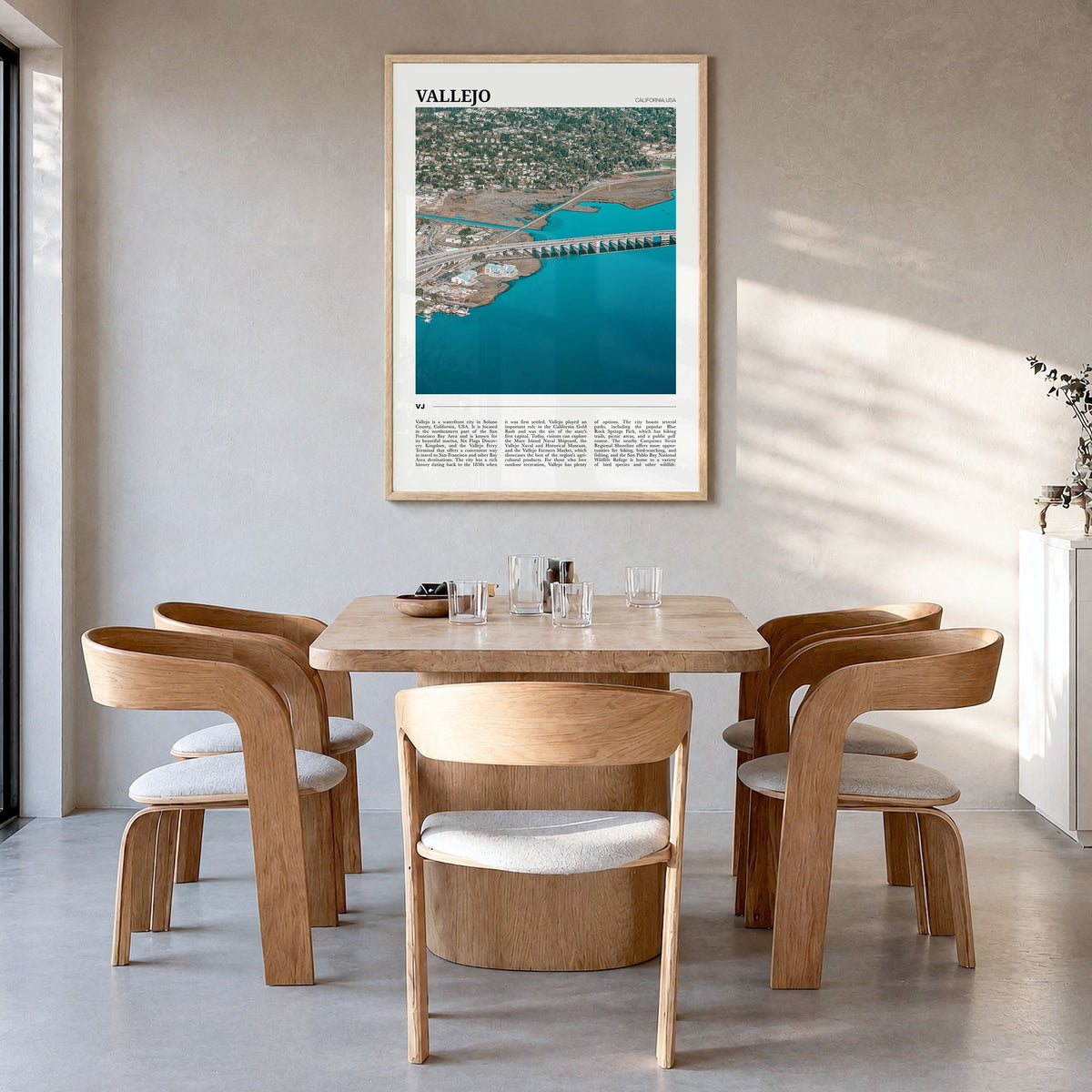 Vallejo Travel Poster in a natural wood frame, hanging in a dining room