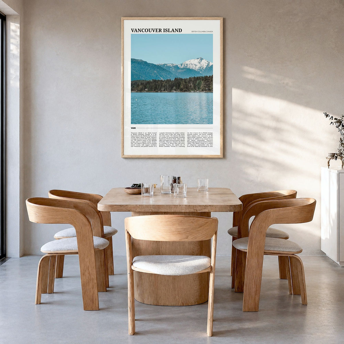 Vancouver Island Travel Poster in a natural wood frame, hanging in a dining room
