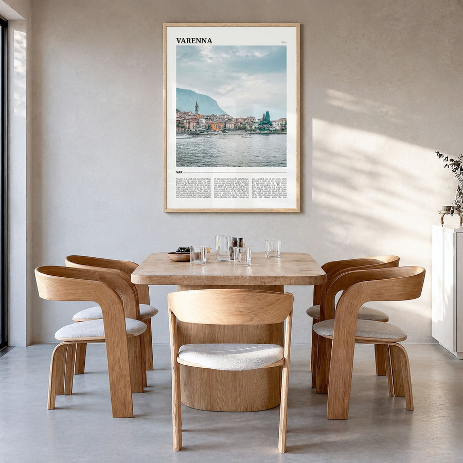 Varenna Travel Poster in a natural wood frame, hanging in a dining room