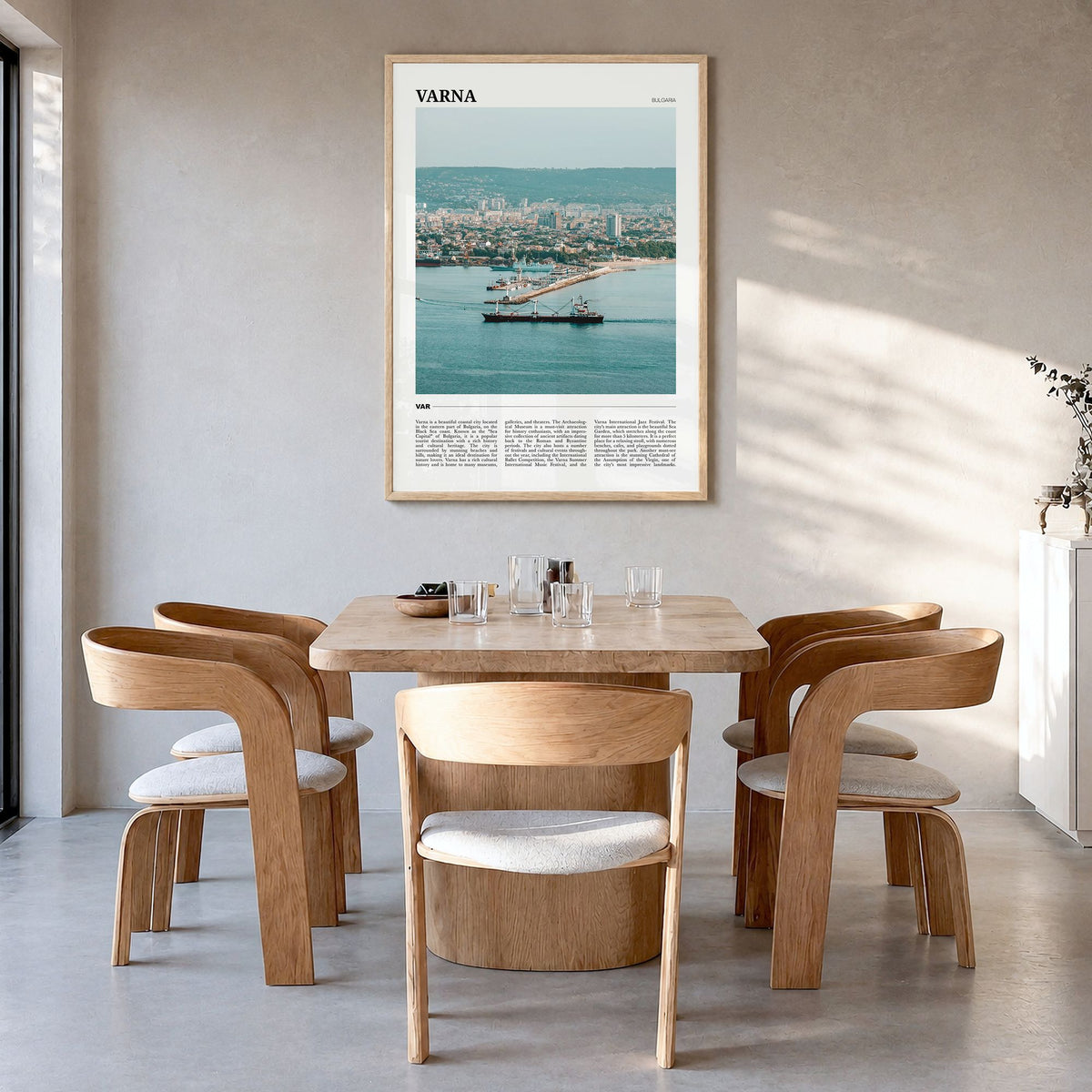 Varna Travel Poster in a natural wood frame, hanging in a dining room