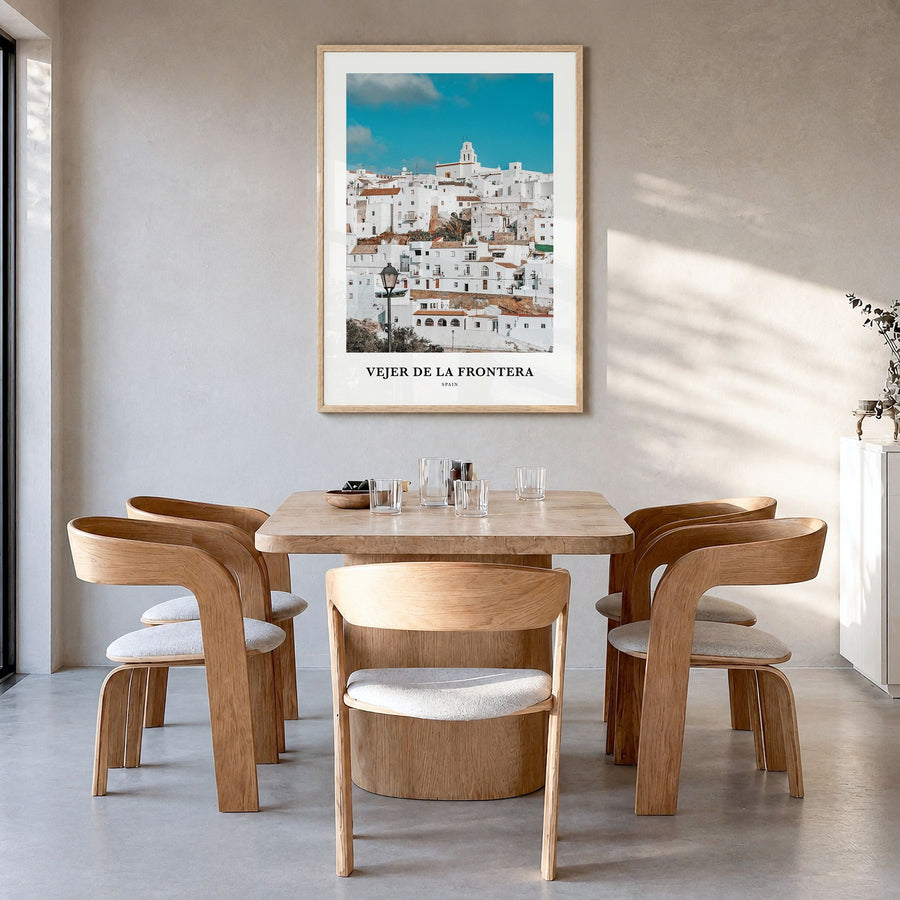 Vejer de la Frontera Classic Poster in a natural wood frame, hanging in a dining room